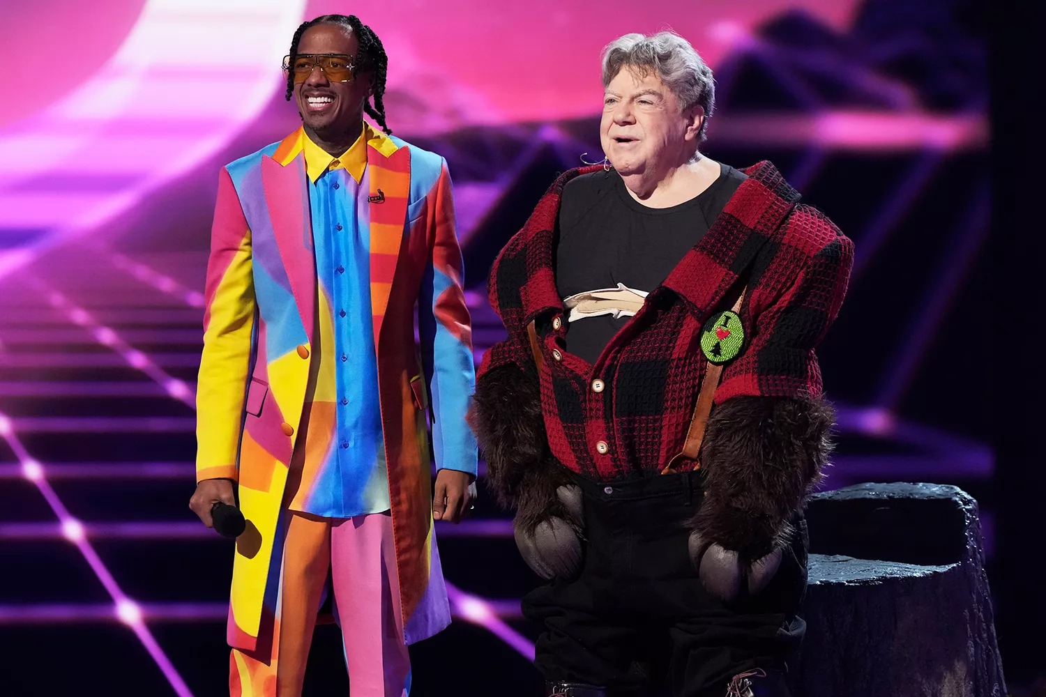 Nick Cannon and George Wendt in the 80s Night episode of THE MASKED SINGER Nick Cannon and George Wendt in the 80s Night episode of THE MASKED SINGER