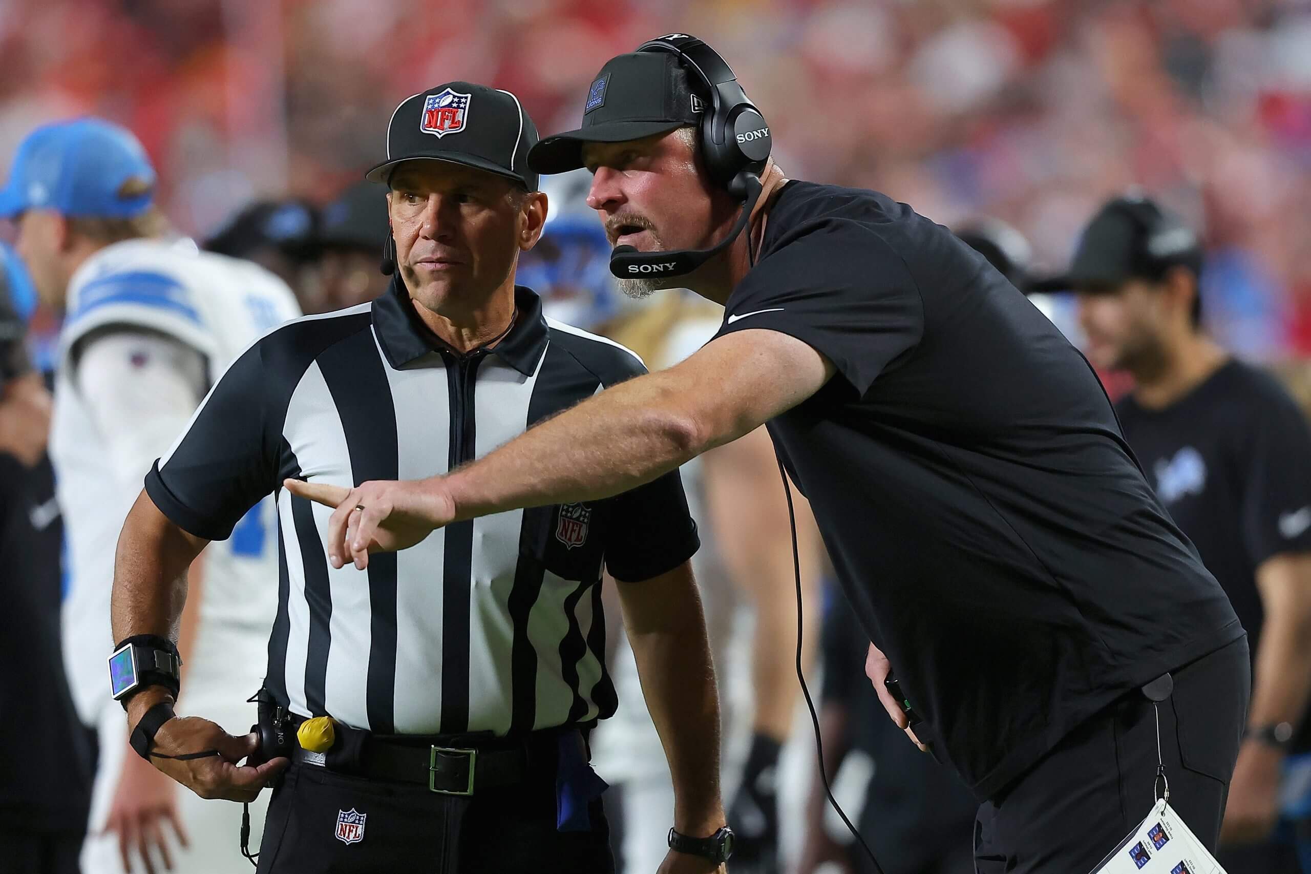 Head coach Dan Campbell of the Detroit Lions speaks with side judge Frank Steratore #132 during the first quarter in the game against the Kansas City Chiefs at Arrowhead Stadium. Head coach Dan Campbell of the Detroit Lions speaks with side judge Frank Steratore #132 during the first quarter in the game against the Kansas City Chiefs at Arrowhead Stadium.